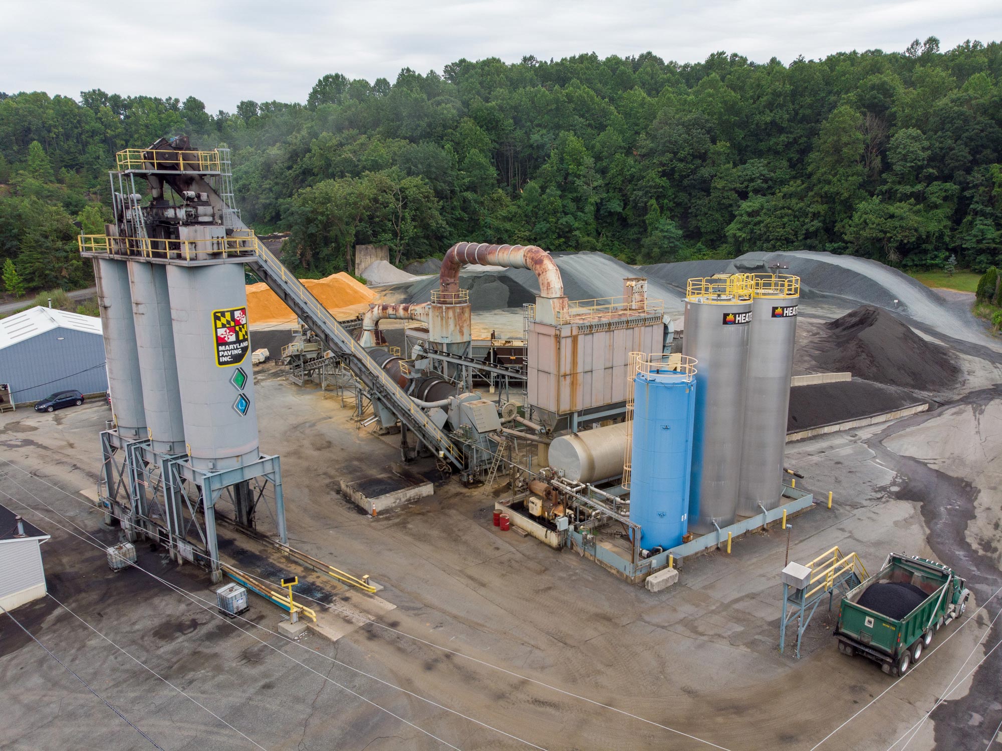 over looking a large asphalt storage silos at a paving plant located in maryland, owned and operated by Gray & Son a leading site and development contractor in Maryland.